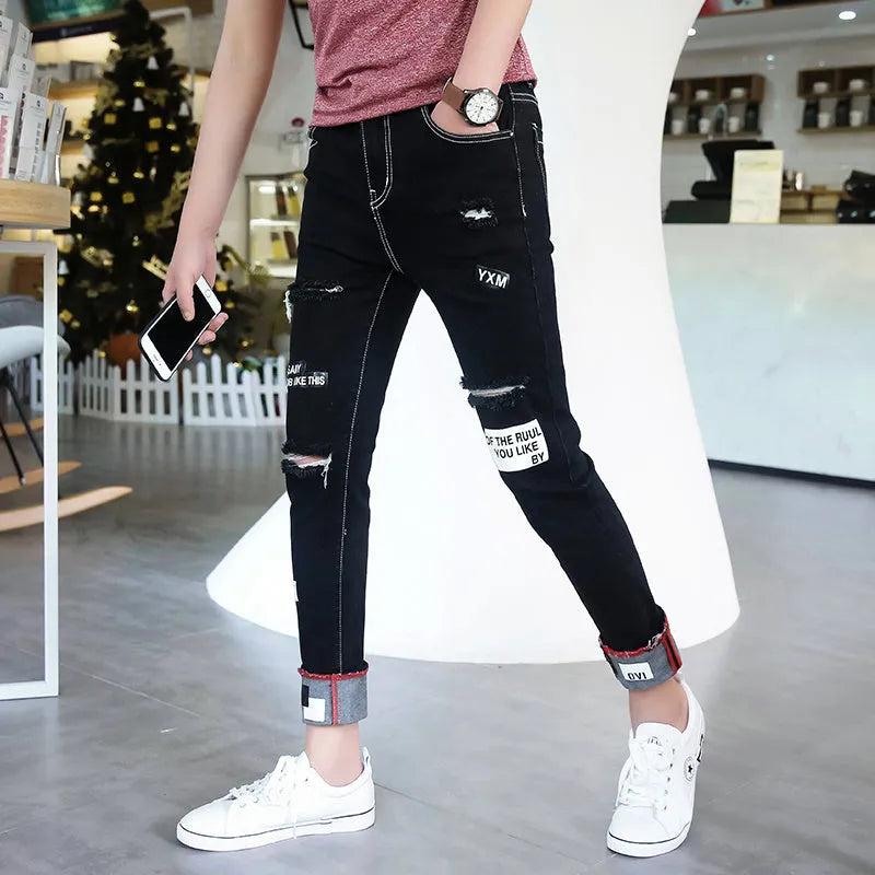 Men's black ripped ankle jeans in regular denim with micro elastic, sizes 28-34, autumn casual style