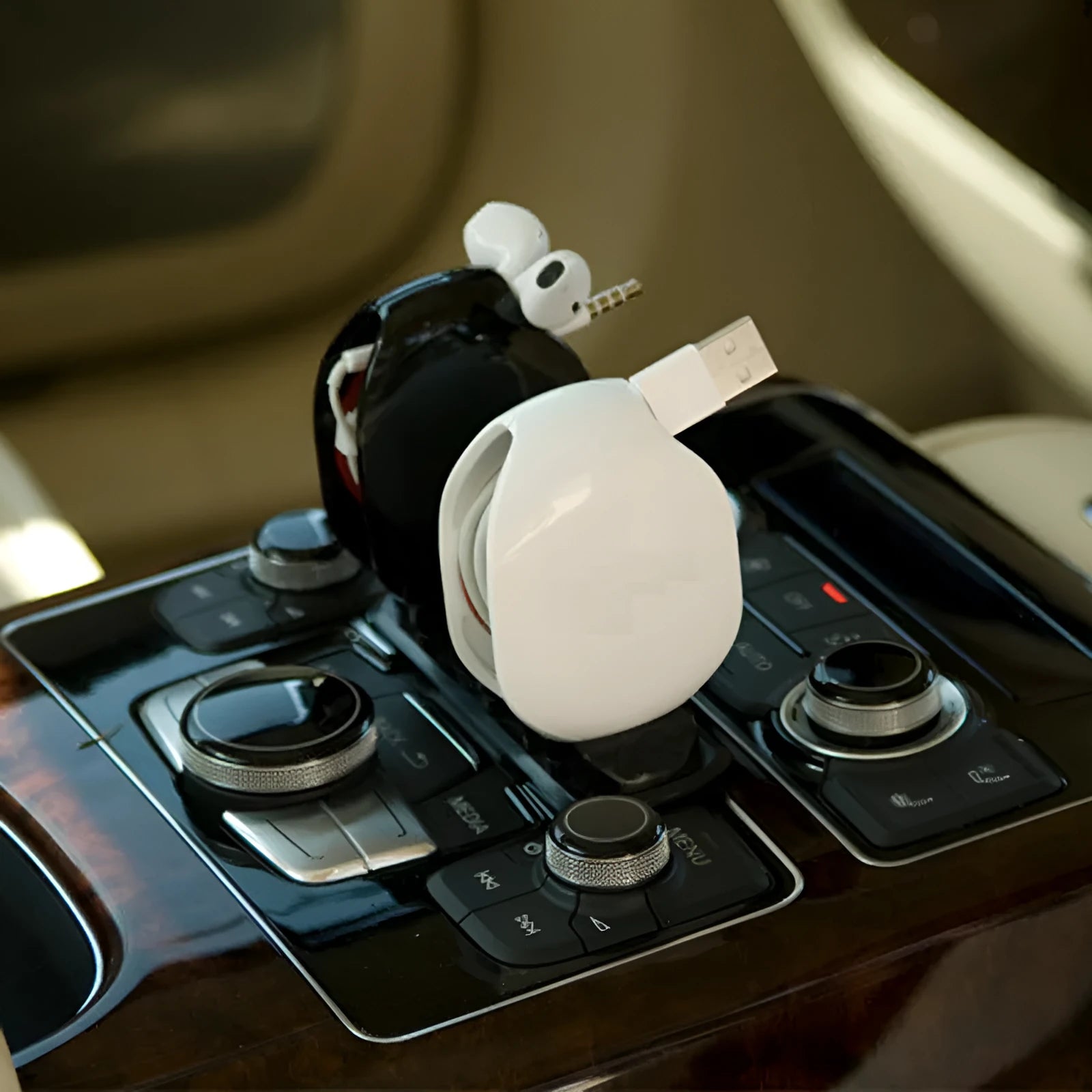 Automatic earphone cable winder showing white, blue, and black units with cable retracted into 72mm storage box.