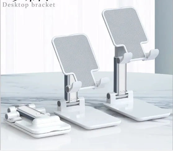 Black adjustable desk mobile phone holder with silicone base on a wooden desk.