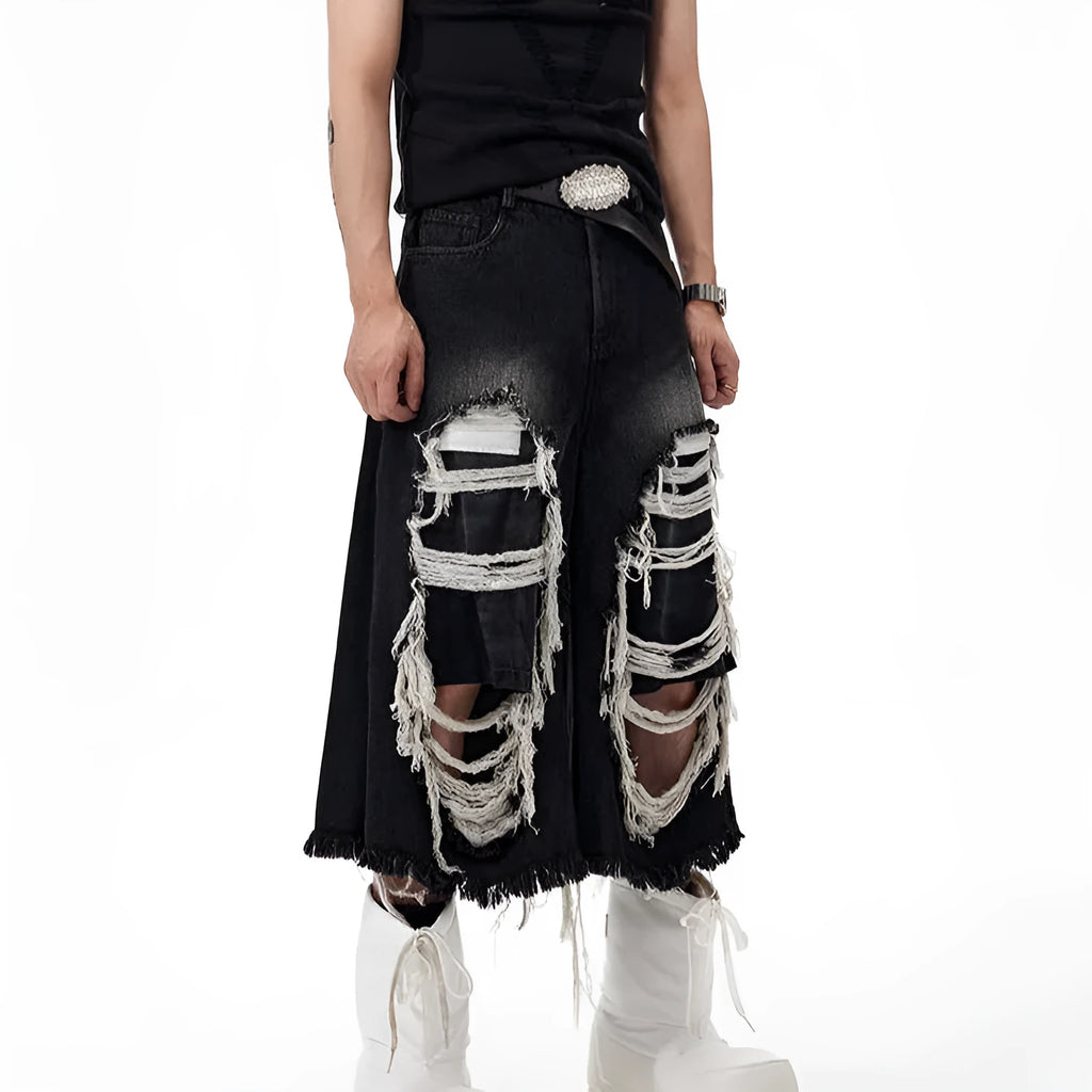 Black women's cropped wide-leg jeans with a mid-high waist and ripped patch details on a loose fit.