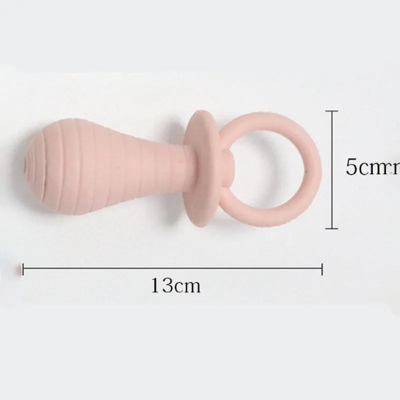 Four coloured TPR rubber pacifier-style pet chew toys with squeakers for puppies and kittens.