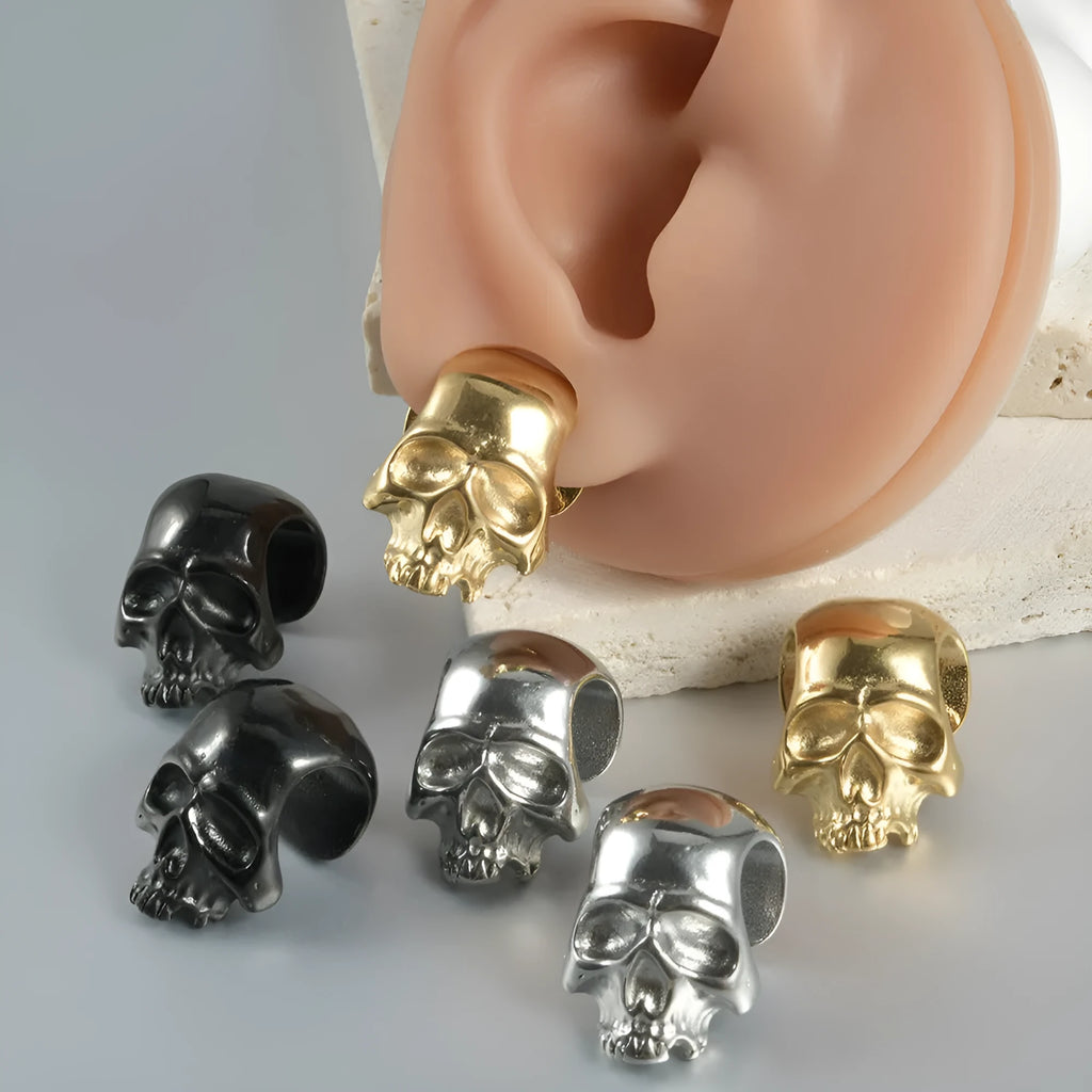 Stainless steel hollow skull and Buddha head earrings in gold, black, steel, and Buddha head colours.