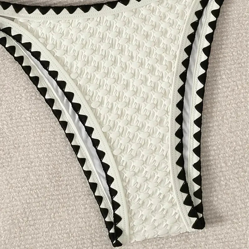 Women's white and blue split bikini swimsuit set with polyester fabric
