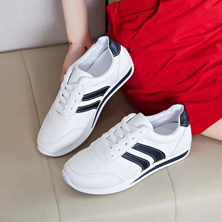 Blue casual lace up soft bottom sneaker with rubber sole and round toe, low top design