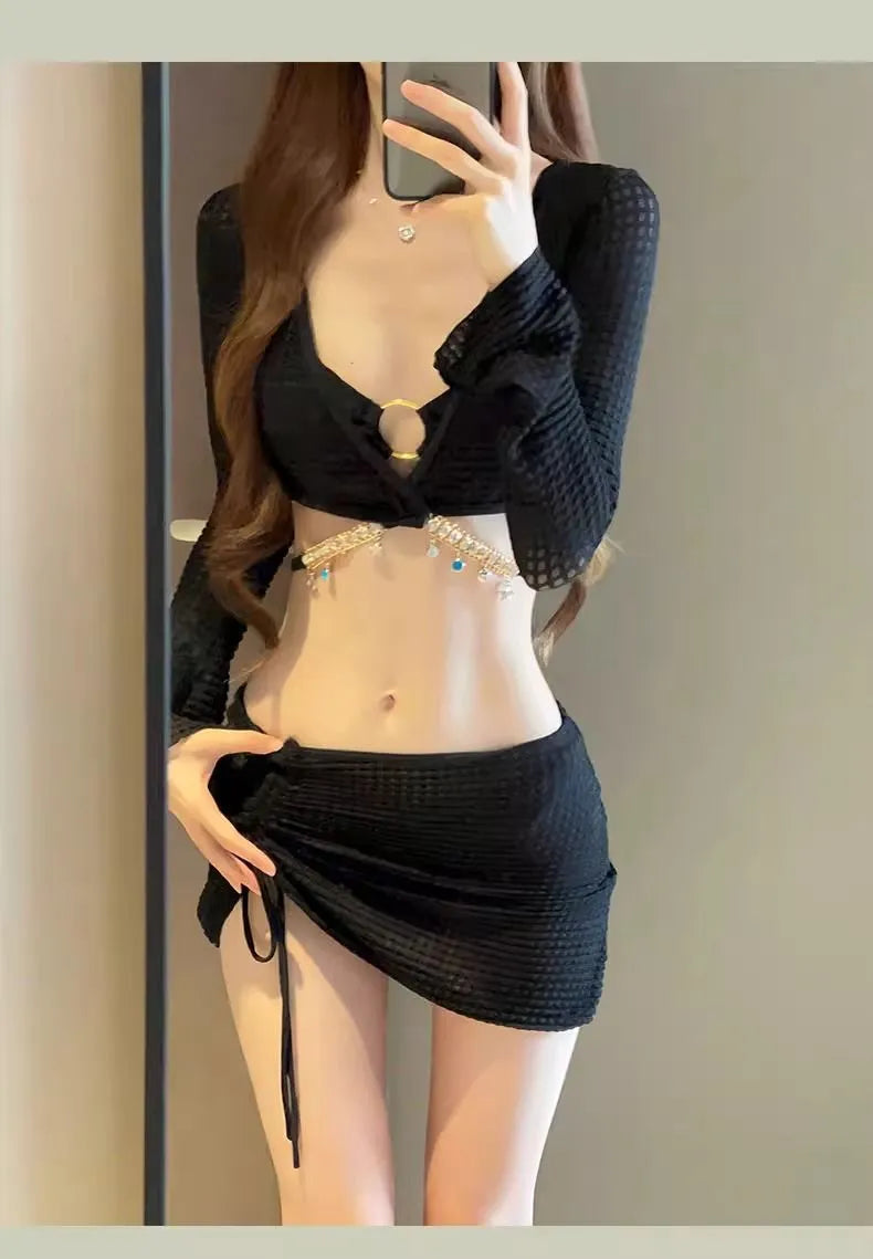 Women's long sleeve black bikini swimsuit with hot spring split style, made from polyester.