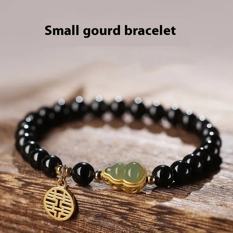 Black obsidian bracelet with a Hetian jade gourd charm, showing geometric beads in 6mm, 8mm, and 10mm size options.