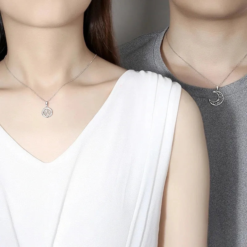 Sun and moon tooth couple necklace set with copper electroplated pendants and cross chain.