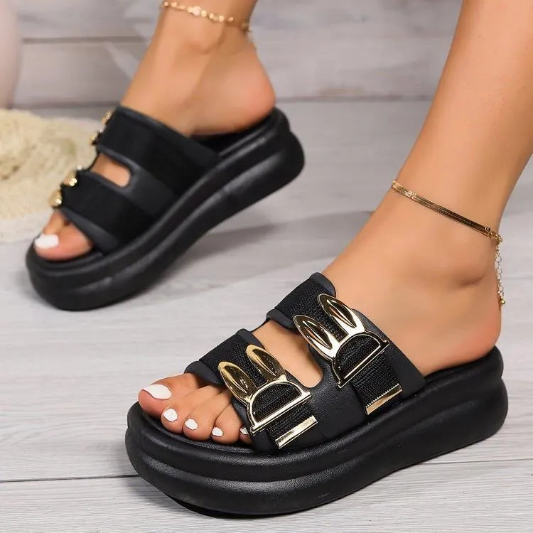 Women's apricot suede slippers with a thick, soft rubber sole on a light background.