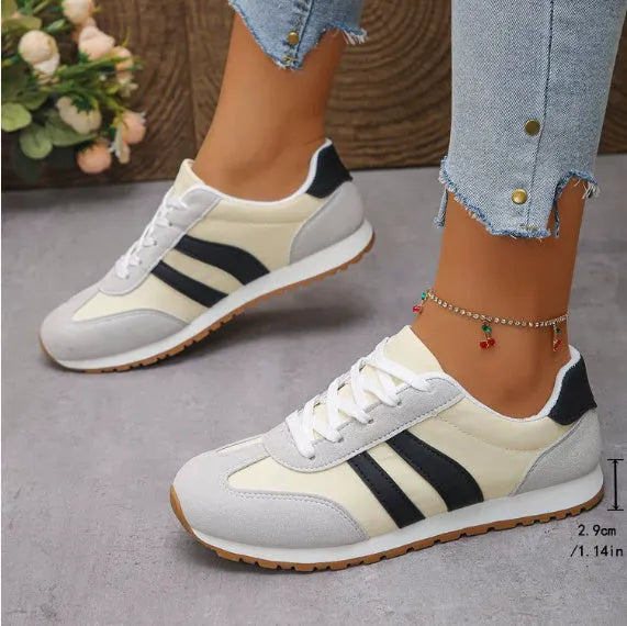 Blue and grey Cortez stripe casual sports shoes with flat heel and round toe on a wear-resistant rubber sole.
