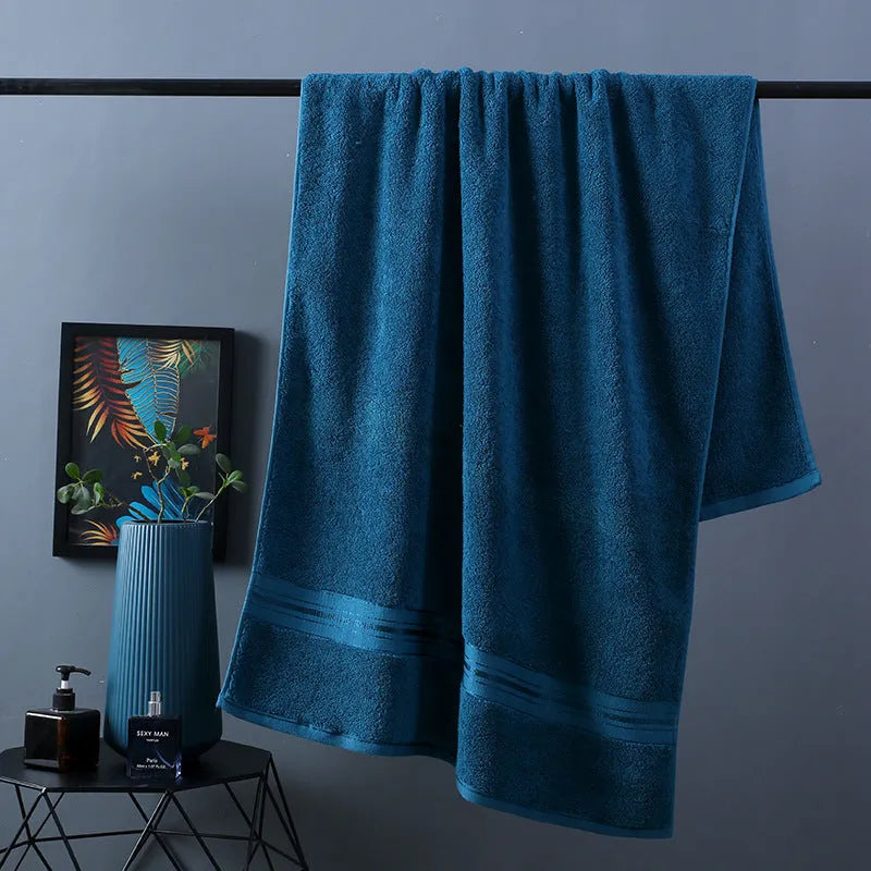 Pure cotton bath towel set showing three pieces in blue colour with floral pattern detail