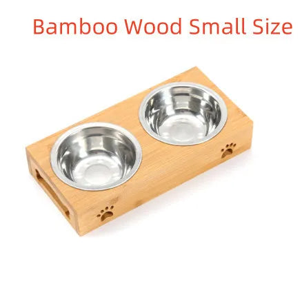 Solid wood pet feeding table with stainless steel bowls in a raised design for cats.