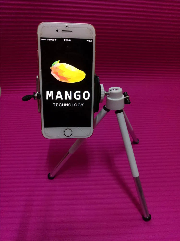 Black aluminium desktop phone holder with a two-section bracket on a wooden desk.