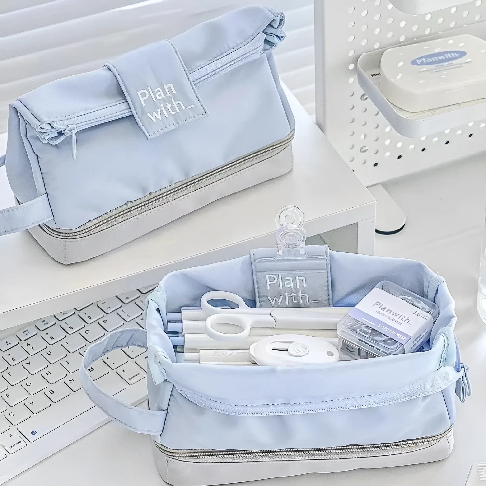 Folding double layer student pencil case in polyester, shown in dark blue, blue, and cream white colour options.