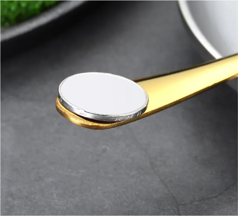 24-piece stainless steel cutlery set showing table knives, forks, and spoons in a gold colour option.