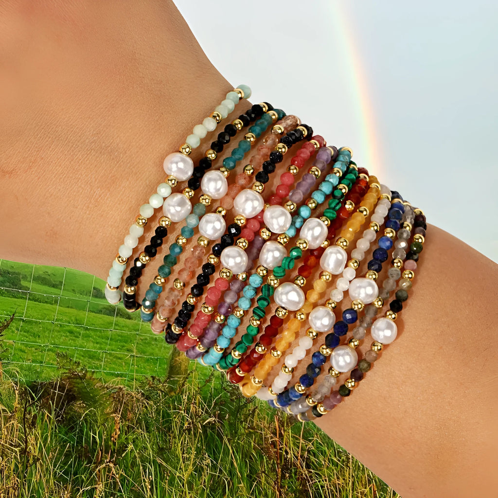 A unisex natural stone bracelet with elliptical geometric beads on a wrist, shown in one of the multiple available colours.