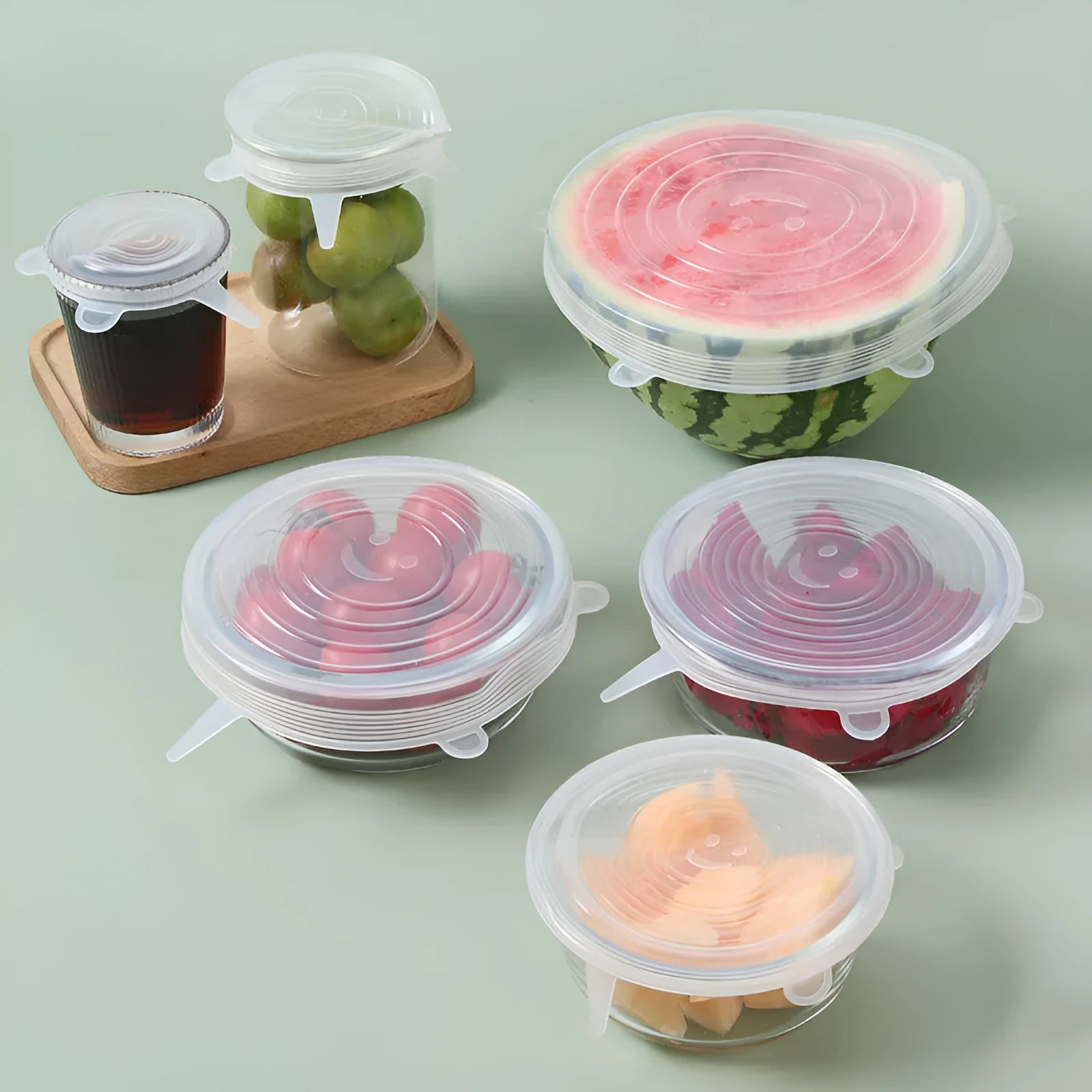 Set of six colourful silicone stretch lids in different sizes for covering bowls and food containers.