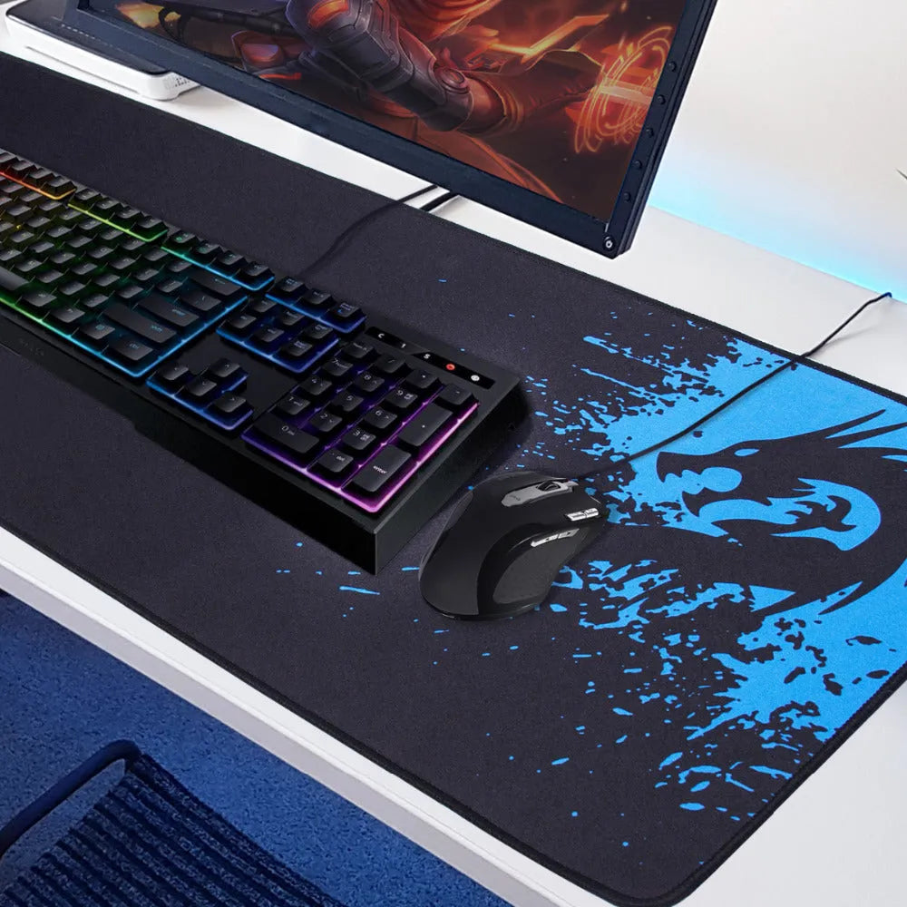 Mouse pad with textured surface and reinforced stitching edges on a desk