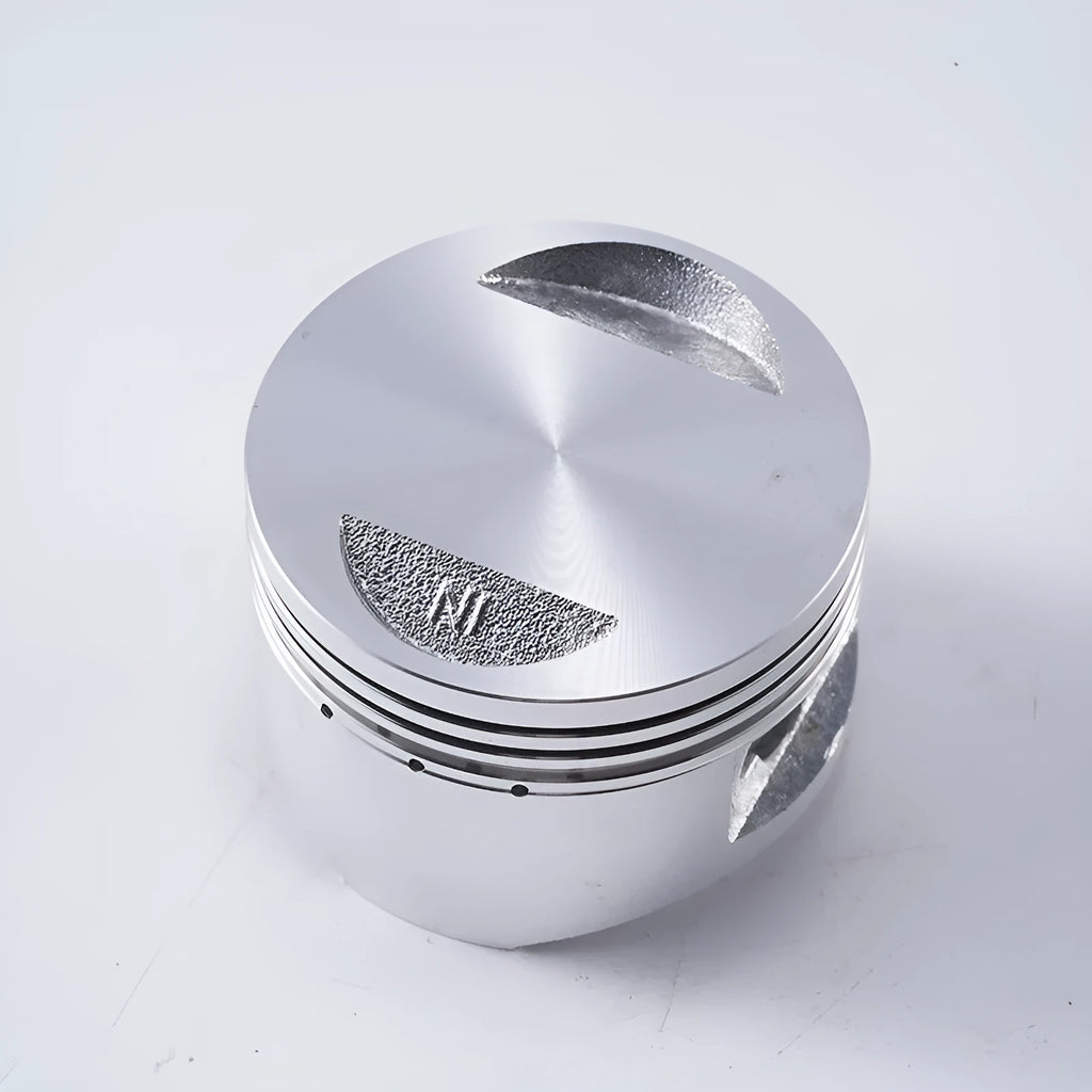 Motorcycle engine piston kit showing aluminium piston with steel combination oil ring for 57.4mm bore