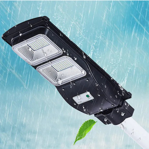 Integrated solar street light unit with solar panel and 60W LED lamp for outdoor use.
