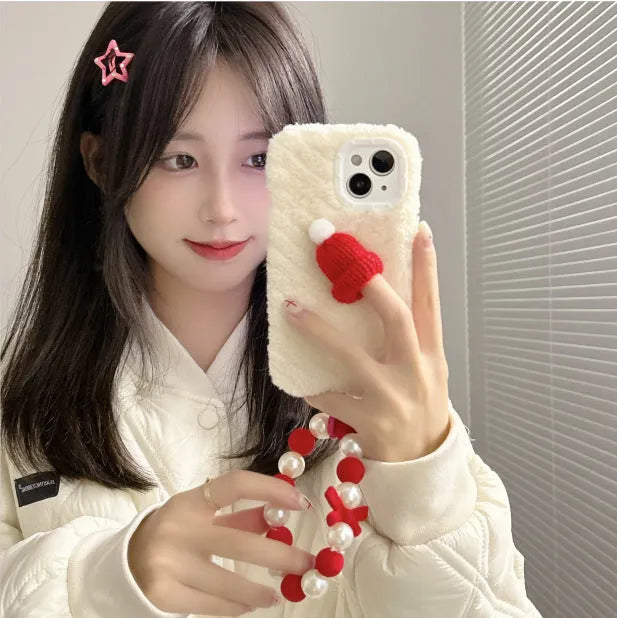 Red silicone phone case with plush Christmas hat bracelet for iPhone 14 Pro Max, back view