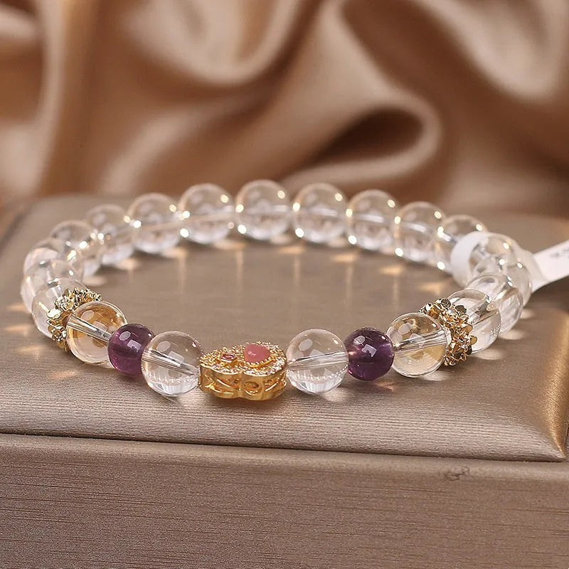 Natural white crystal bracelet for women with transparent gourd detail on light background