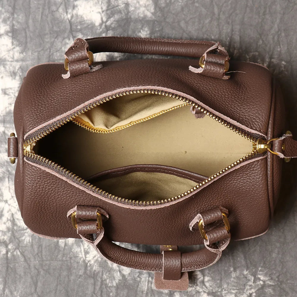 Brown handmade cowhide leather Boston bag with cylindrical shape and single shoulder strap