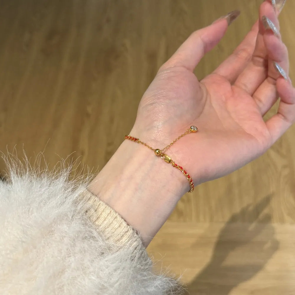 Women's 925 sterling silver bracelet with red rope, gold electroplated finish, and geometric ring design