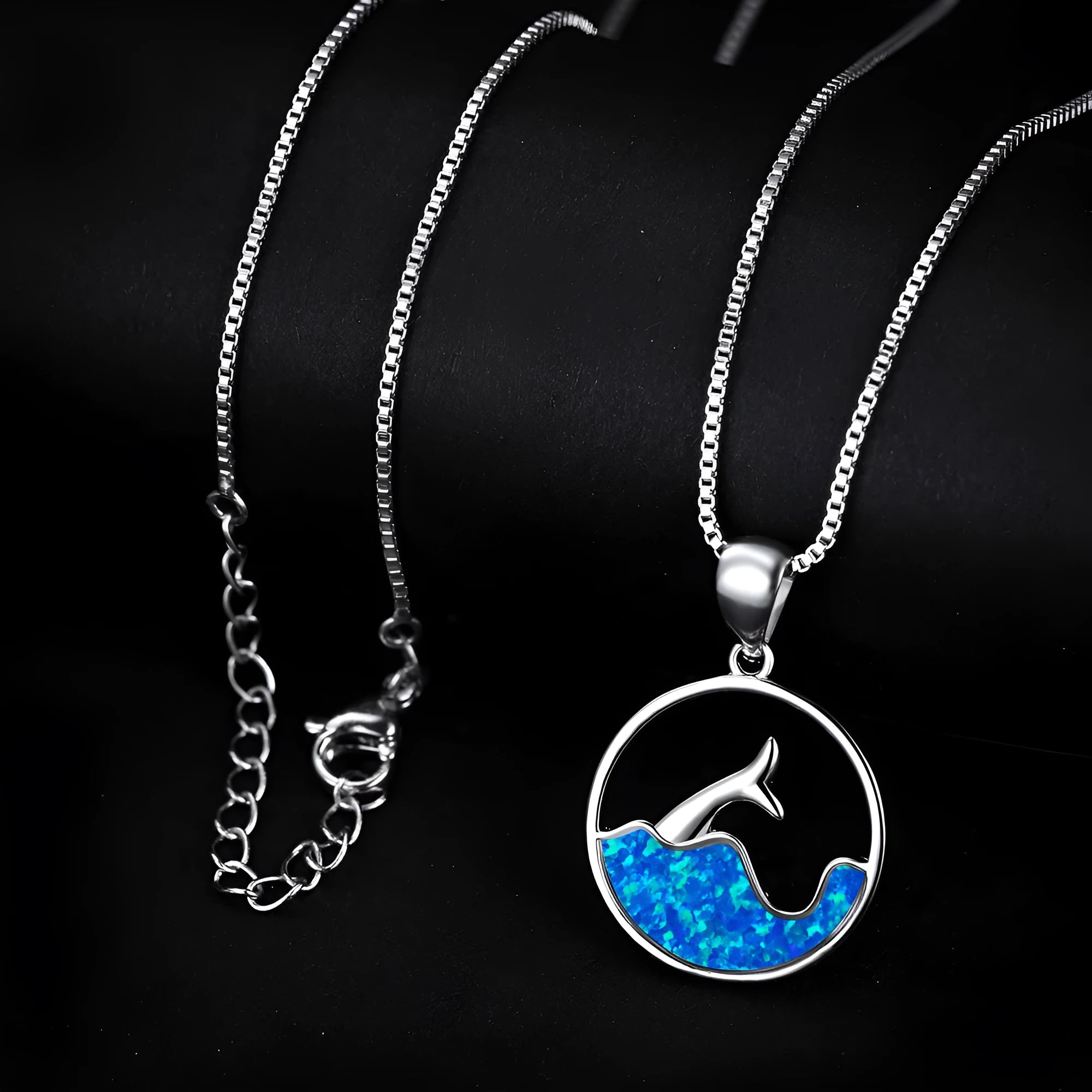 A round geometric pendant necklace with an electroplated opal finish on a copper chain.