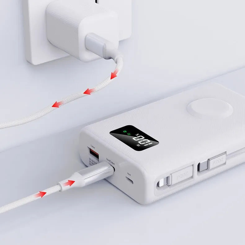 Black wireless power bank with charging bracket showing display screen and multiple USB ports