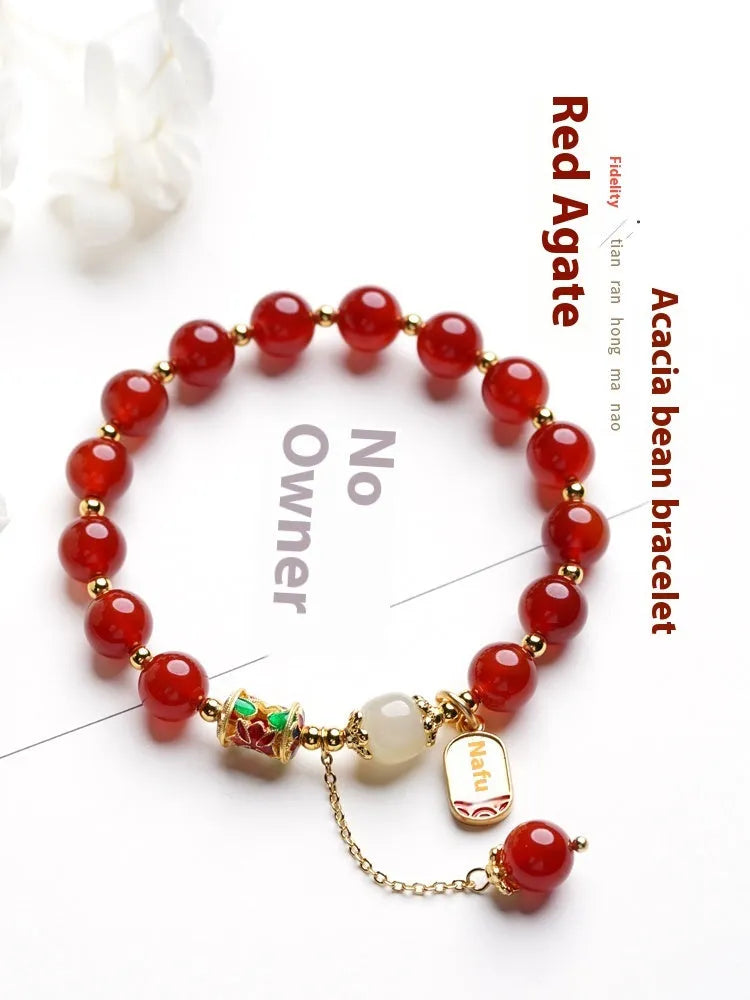 Women's bracelet with red agate and Hetian jade beads on gold-plated links in three design styles.