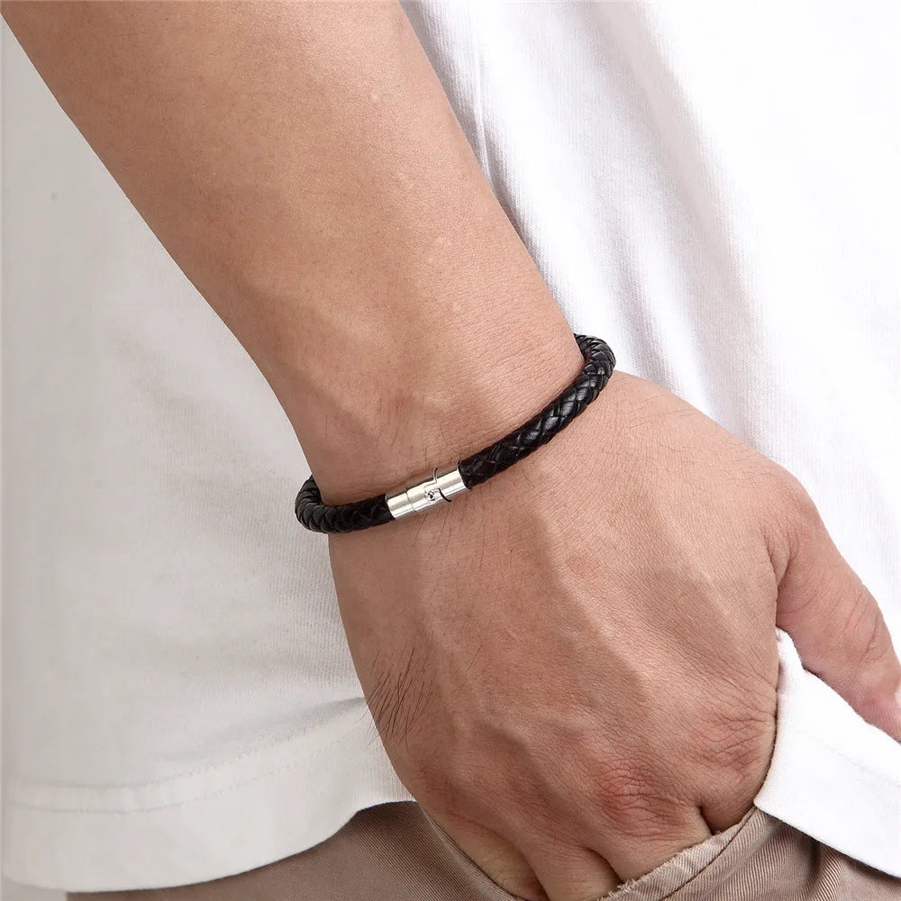 Geometric titanium steel wire bracelet with magnetic clasp on a wrist, showing minimalist unisex design.