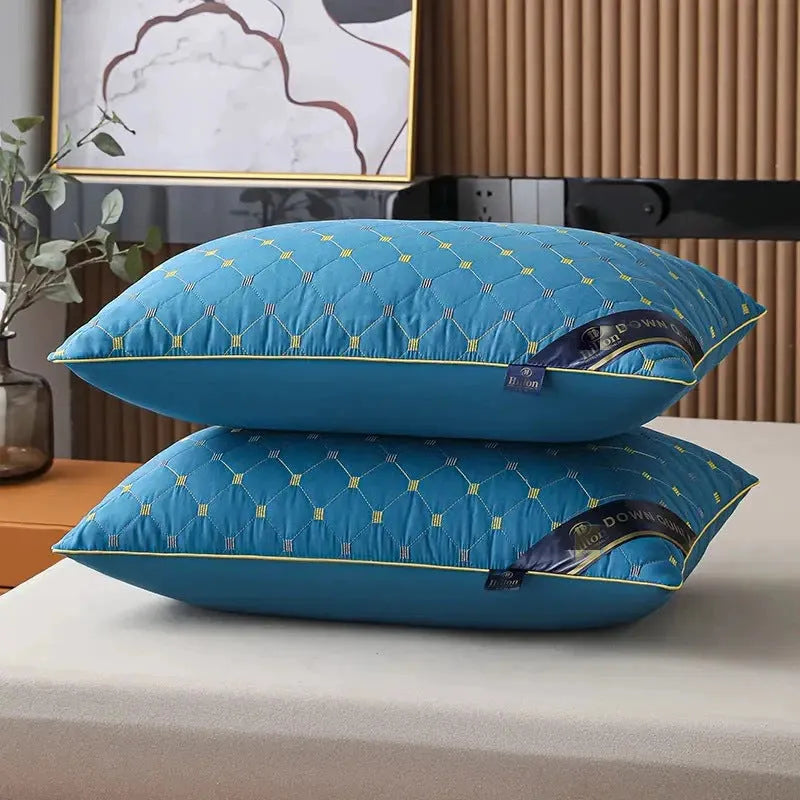 A white chemical fibre bedding pillow with a polyester shell, shown next to a blue argy wormwood patterned variant.