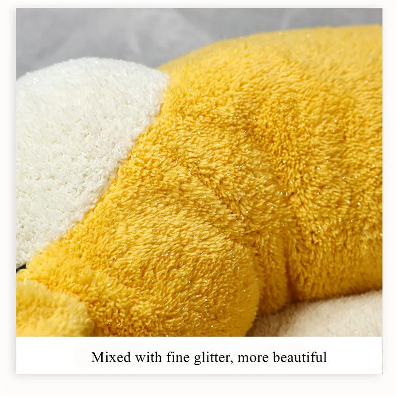 Corgi shaped plush pet bed for dogs and cats with raised edges.