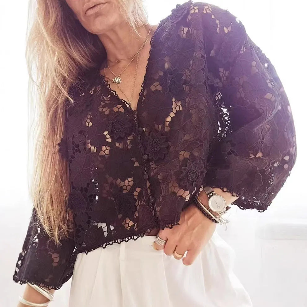 Black loose fit lace cardigan with V-neck and 3D floral decoration on a hanger