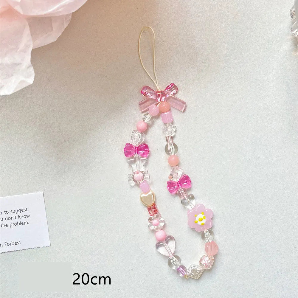 A blue beaded flower mobile phone lanyard with a hand rope design, measuring 1 metre long.
