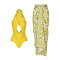 Women's solid colour halter one-piece swimsuit with matching wrap skirt set