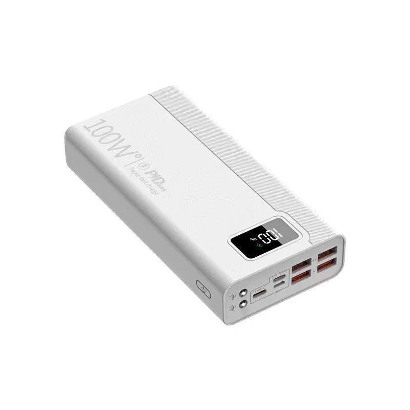 Large black and white power bank showing size comparison next to a mobile phone.