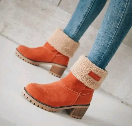 Women's mid-calf suede snow boots with a low flat heel and round toe in various colours.