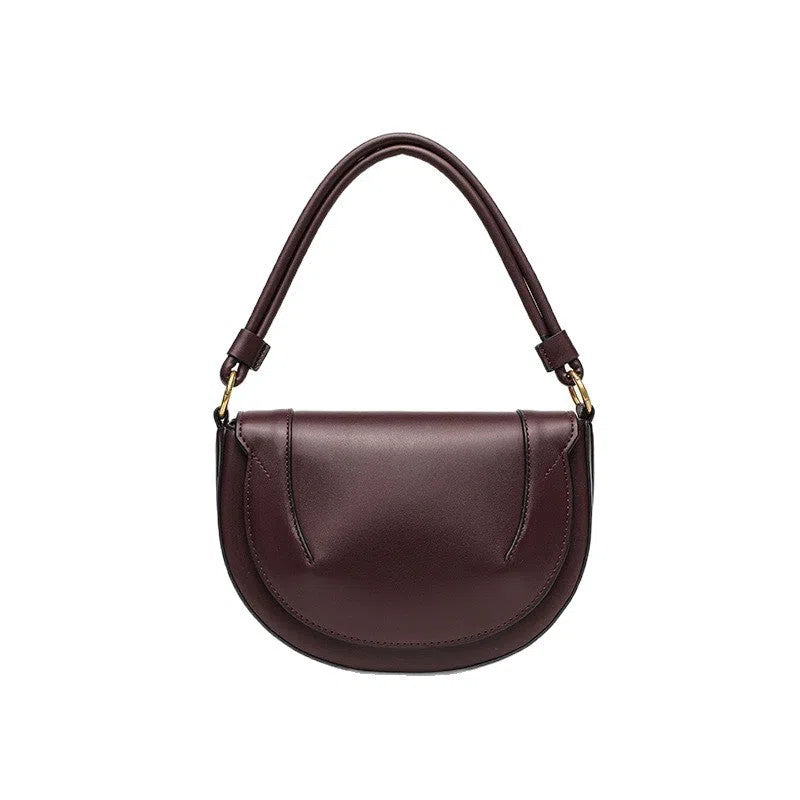Medium PU saddle bag with magnetic clasp in black oval shape 16x24x8.5cm women's handbag