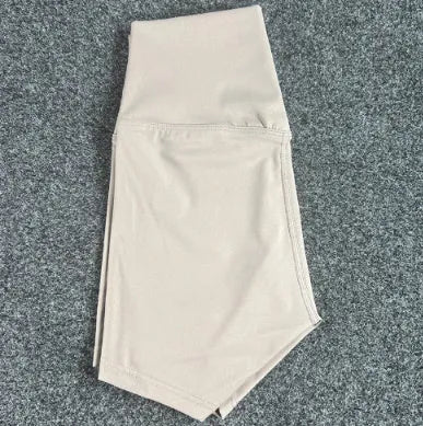 High-waisted women's yoga shorts in nylon fabric, shown in a selection of colours including pink litchi and cayenne red.