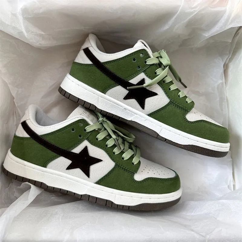 Women's retro green lace-up board shoes with round toe and flat rubber sole on a plain background