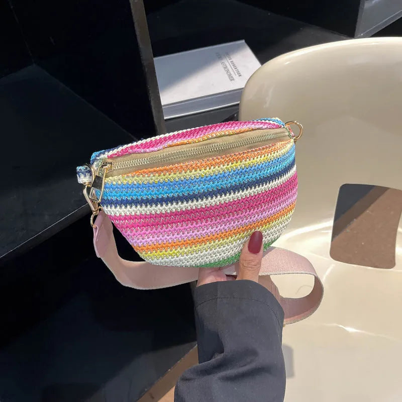 Blue woven straw beach bag with shell shape design and adjustable shoulder strap