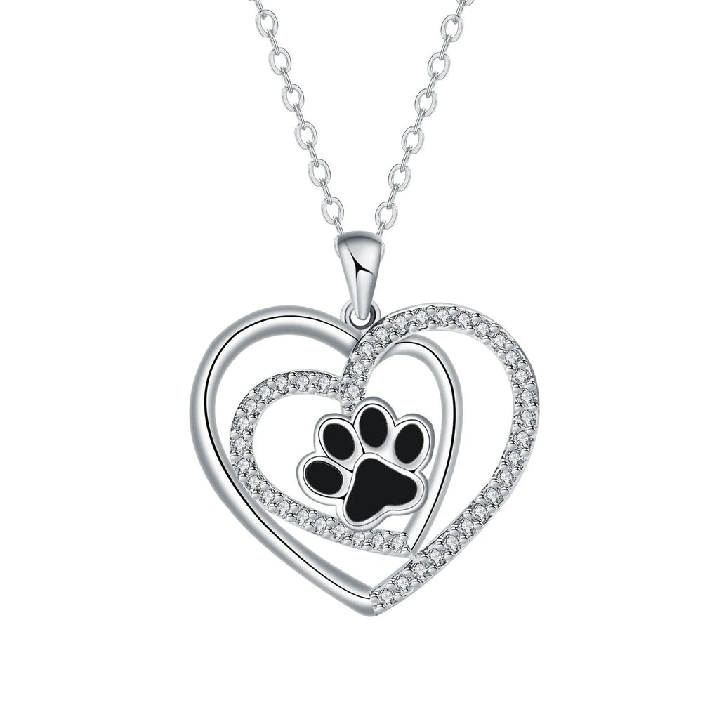 Women's copper necklace with dog paw print and heart pendant on cross chain