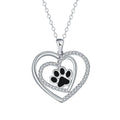 Women's copper necklace with dog paw print and heart pendant on cross chain