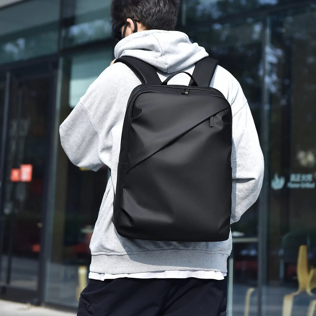 Large capacity waterproof PU leather backpack in black colour with sewing thread detailing