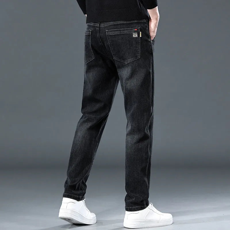Men's slim straight casual trousers in blue grey colour showing loose fit and pencil-leg style.