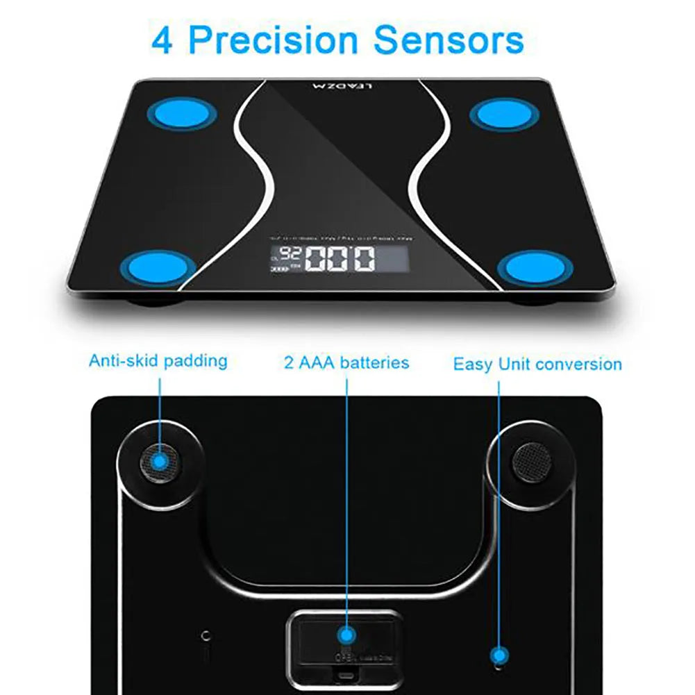 Black electronic digital bathroom scale on a floor showing a maximum capacity of 180 kg.