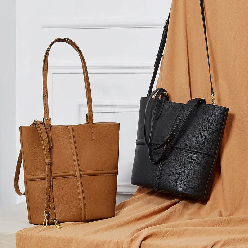 First layer cowhide bucket crossbody bag in black or golden brown, 26cm x 15cm x 29cm, open pocket, polyester cotton lining.
