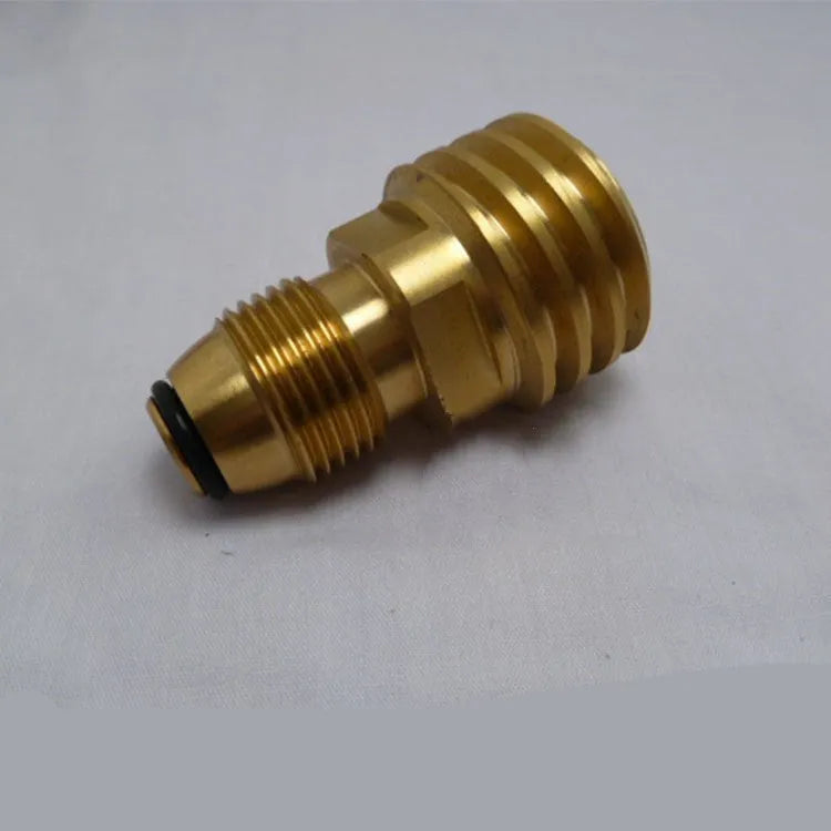 Gold-coloured brass gas adapter with external taper thread for brazier fuel lines.