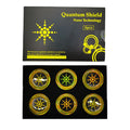 Six mobile phone anti-radiation stickers in silver and gold colours with self-adhesive backing